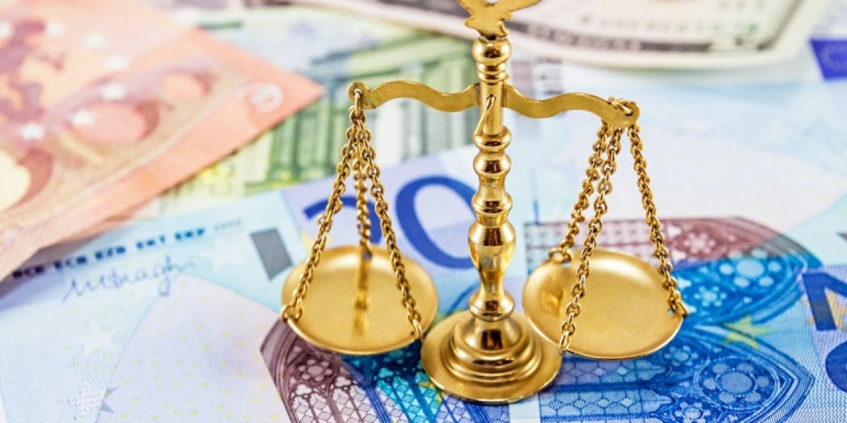 Retro law scales on different banknotes. Symbol of justice.